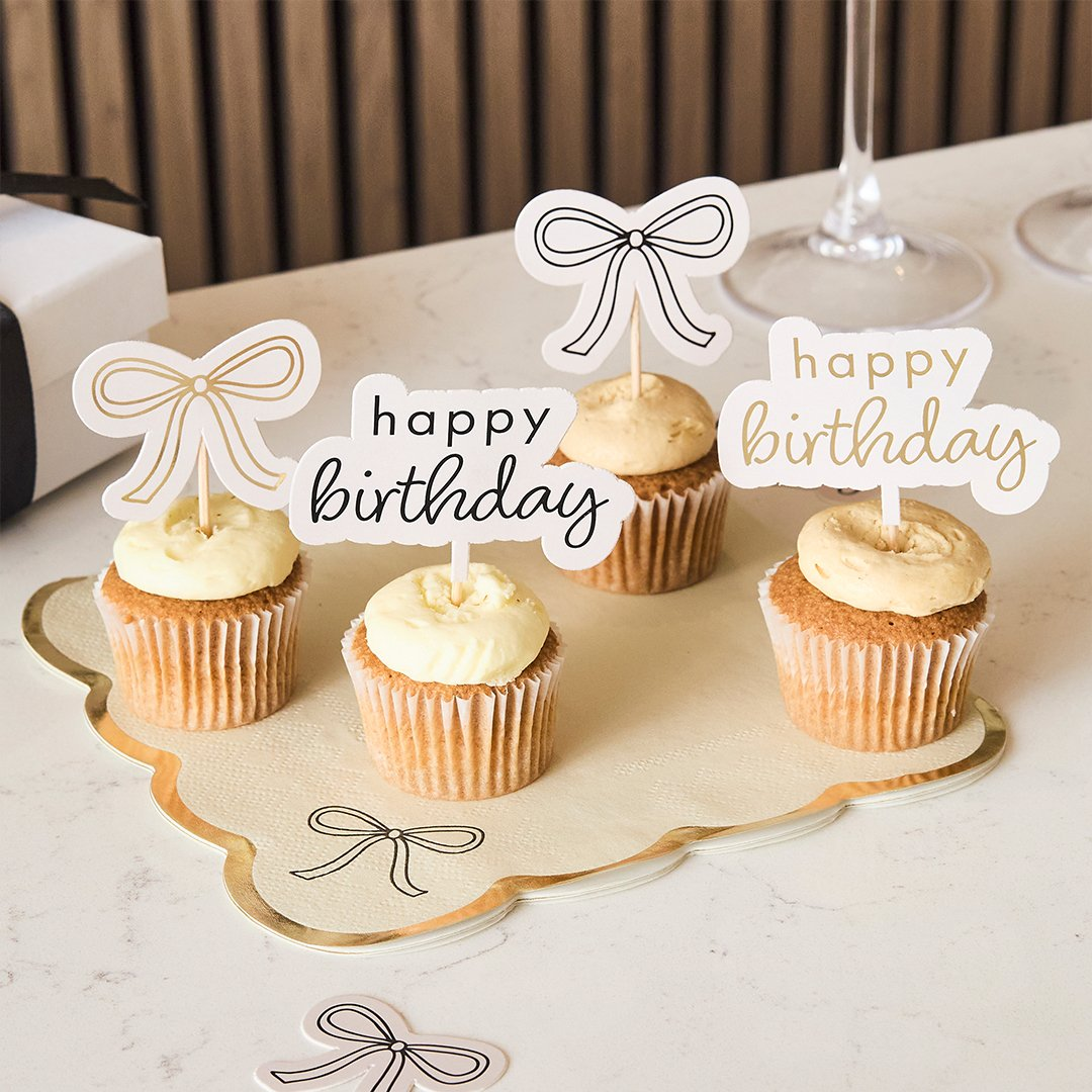 Toppere pentru brioșe „Birthday Bow” (12 buc) crem cu fundiță aurie și neagră