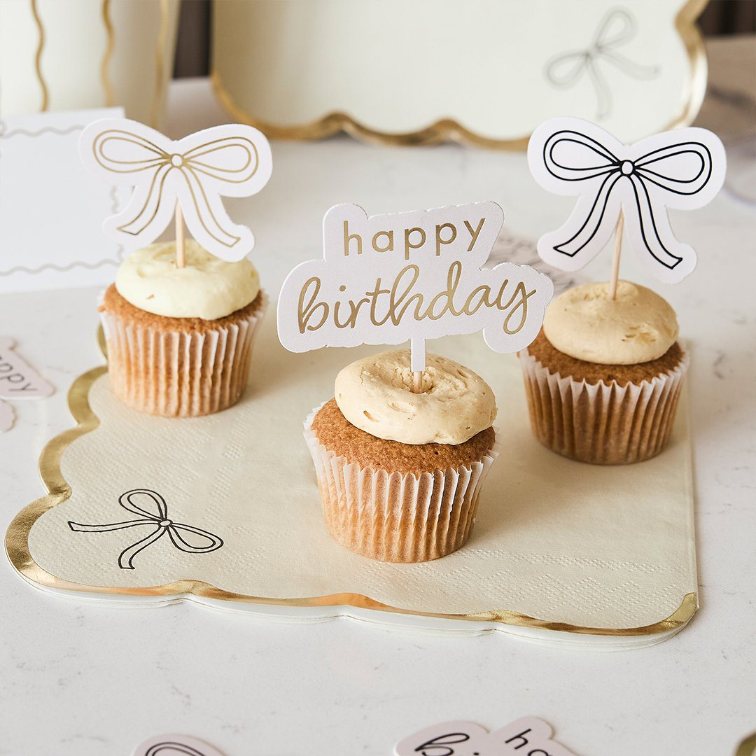 Toppere pentru brioșe „Birthday Bow” (12 buc) crem cu fundiță aurie și neagră